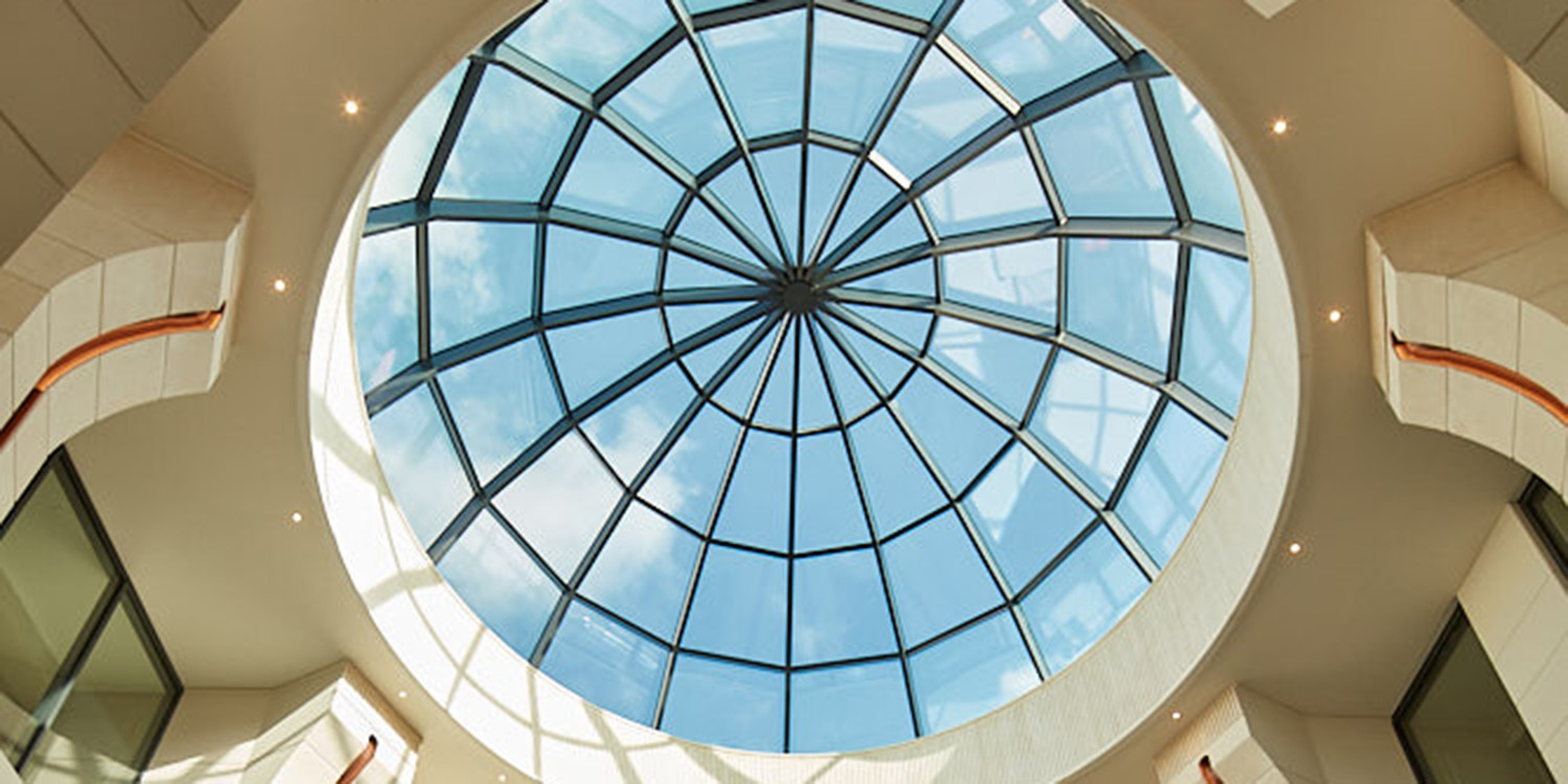 internal view looking up through rooflight to blue sky